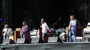 The Black Crowes performing on a festival stage in daylight